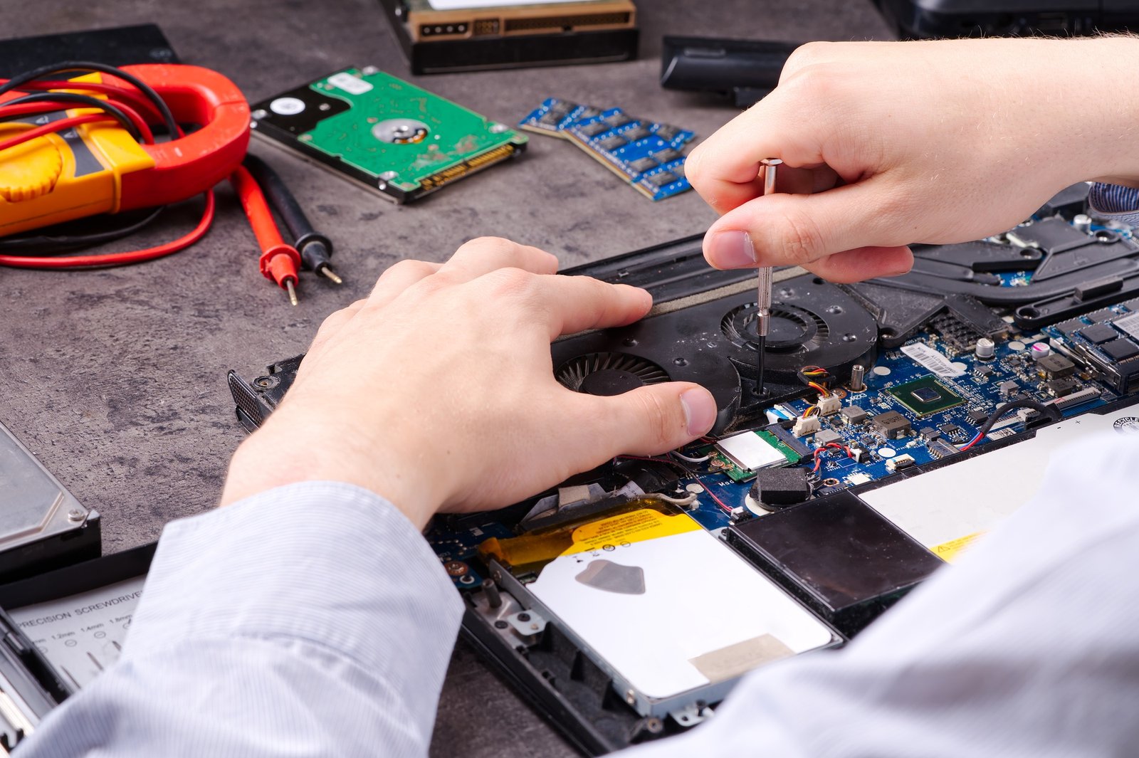 Home 4 hands fixing motherboard of pc or laptop notebook close up in service laptop repair service