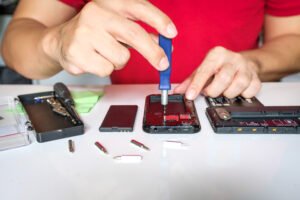 Why Is My Iphone Overheating? Causes, Fixes And When To Get Help 4 device repair with screwdriver on a table 2026 03 16 01 22 36 utc