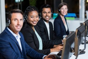 Best It Support In Essex — What Good Actually Looks Like 2 smiling call center team working at computers 2026 04 14 00 06 13 utc