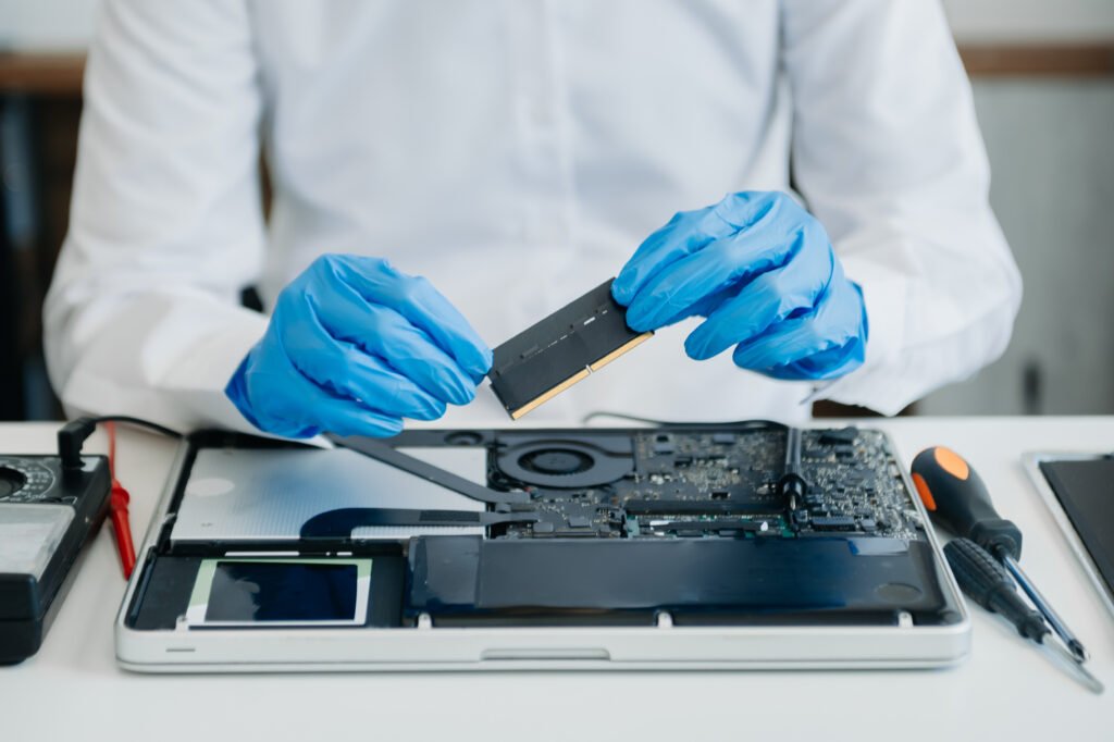 Virus, Spyware, Antivirus — What To Do When Your Laptop Gets Infected And How To Stay Protected 3 technician repairing laptop with blue protective g 2026 09 22 06 01 32 utc